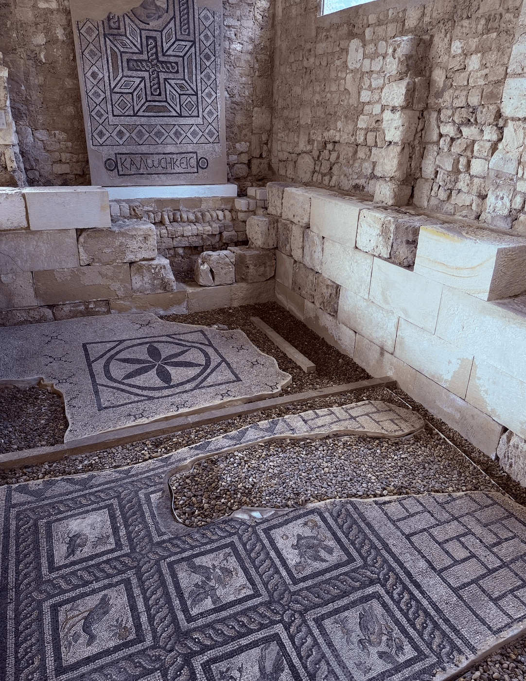 Ancient Roman mosaic floor tiles with geometric patterns at Alexandria archaeological site