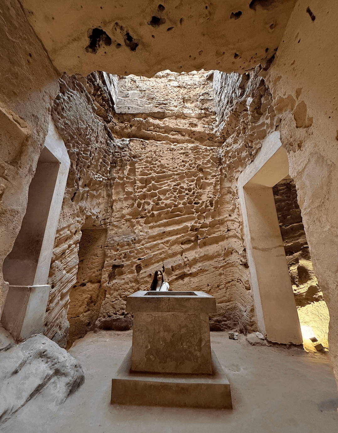 Catacombs of Kom El Shoqafa underground burial chamber with stone sarcophagus in Alexandria