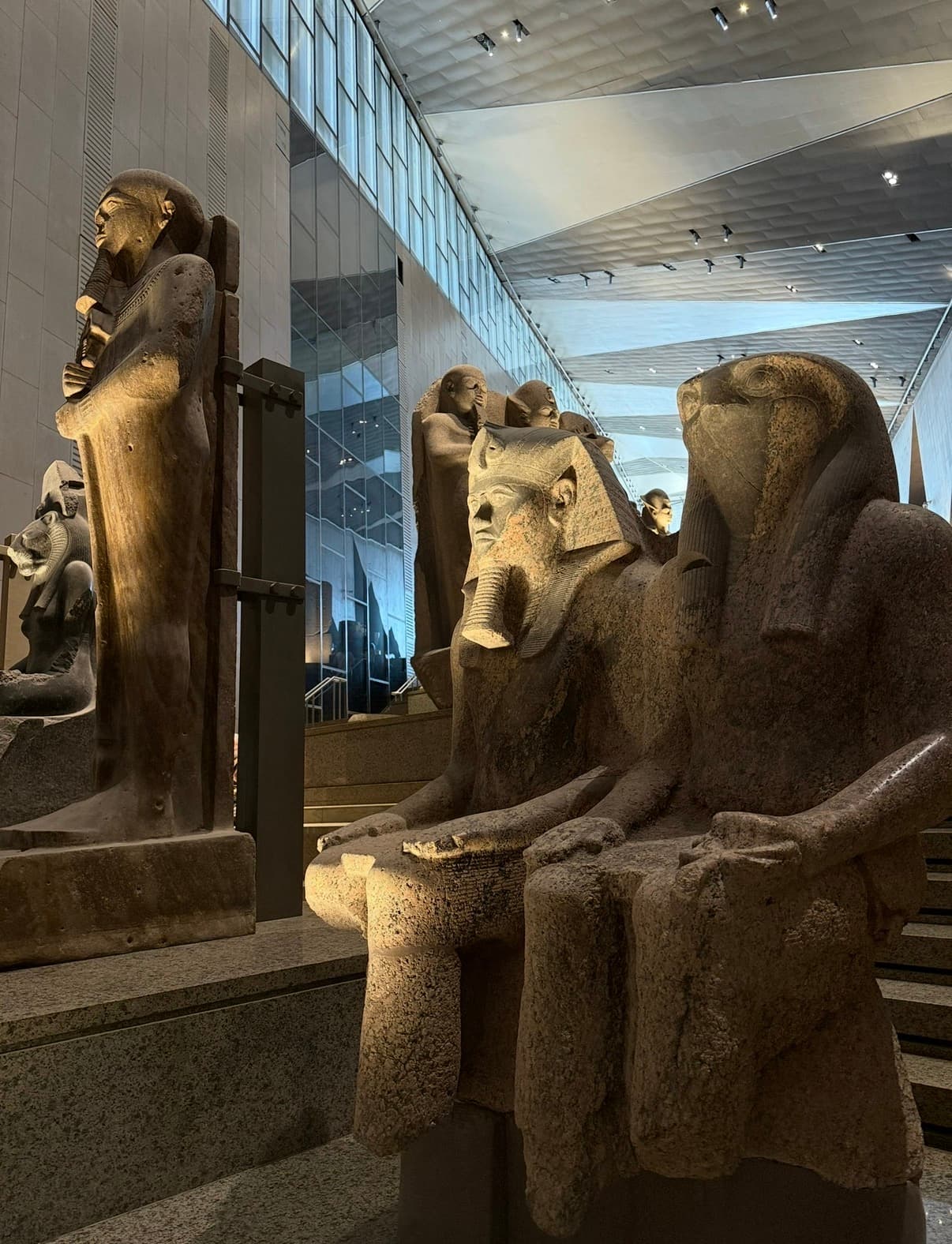 Collection of pharaoh statues and sphinxes on the Grand Staircase