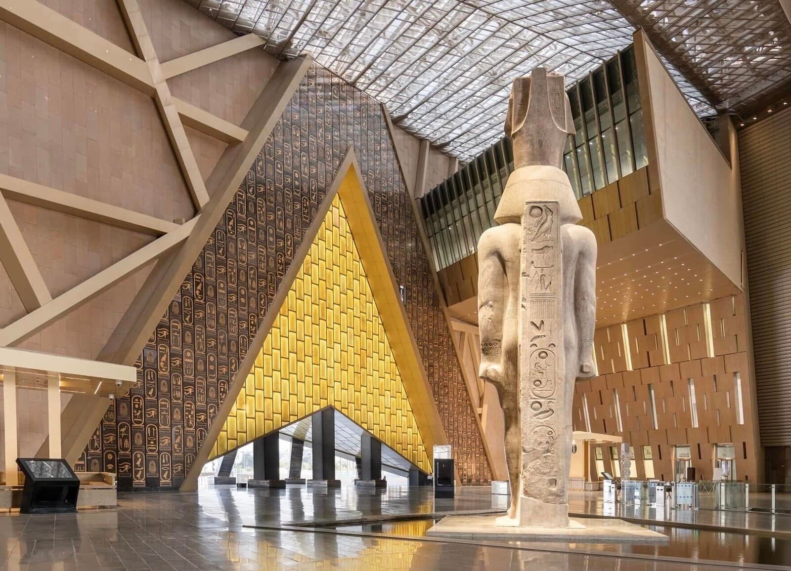 Grand Egyptian Museum interior showcasing Ramesses II statue and modern architecture