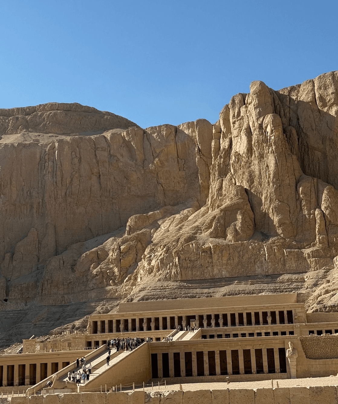 Mortuary Temple of Queen Hatshepsut at Deir el-Bahari with dramatic limestone cliffs