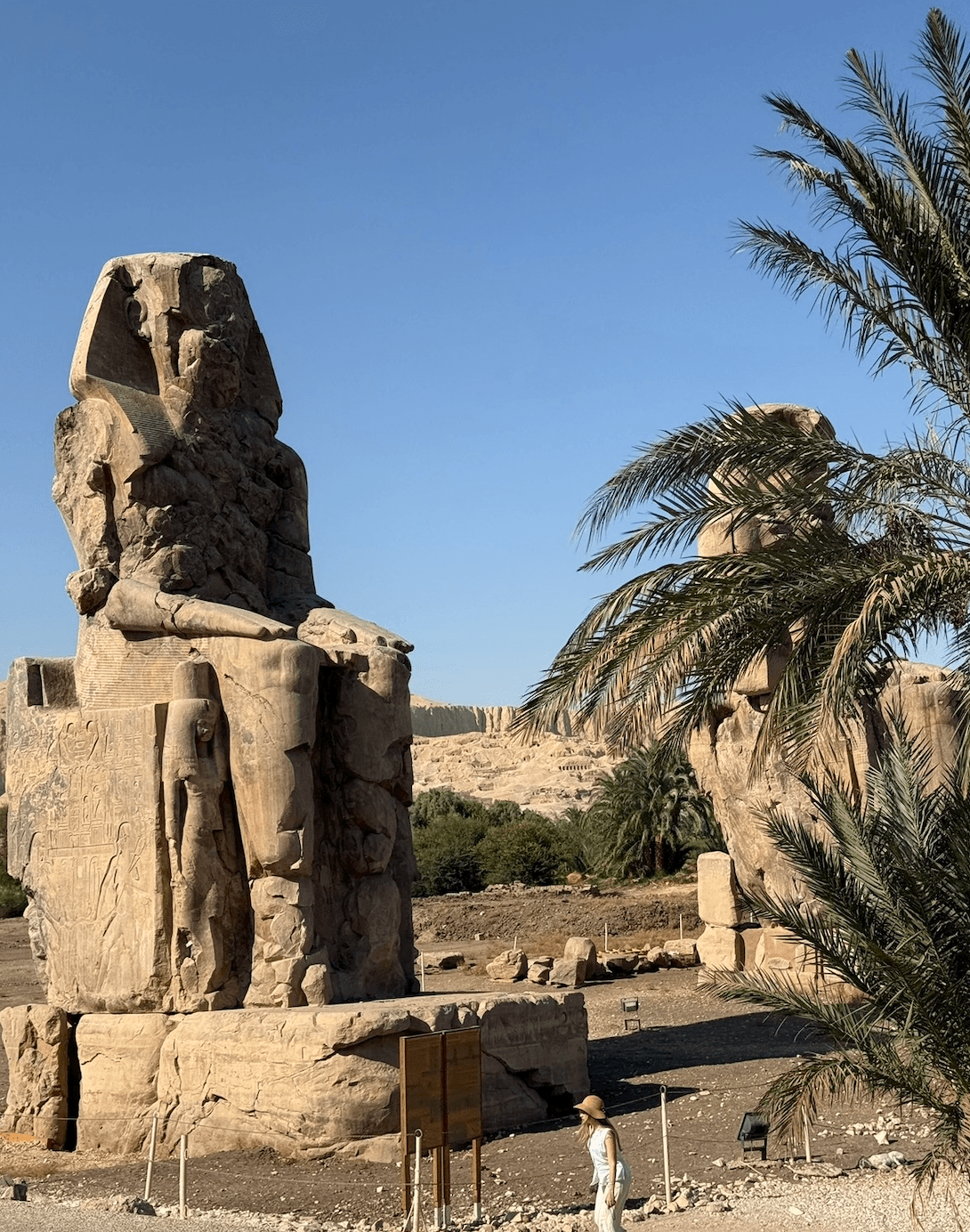 Colossi of Memnon massive stone statues at Theban Necropolis in Luxor Egypt