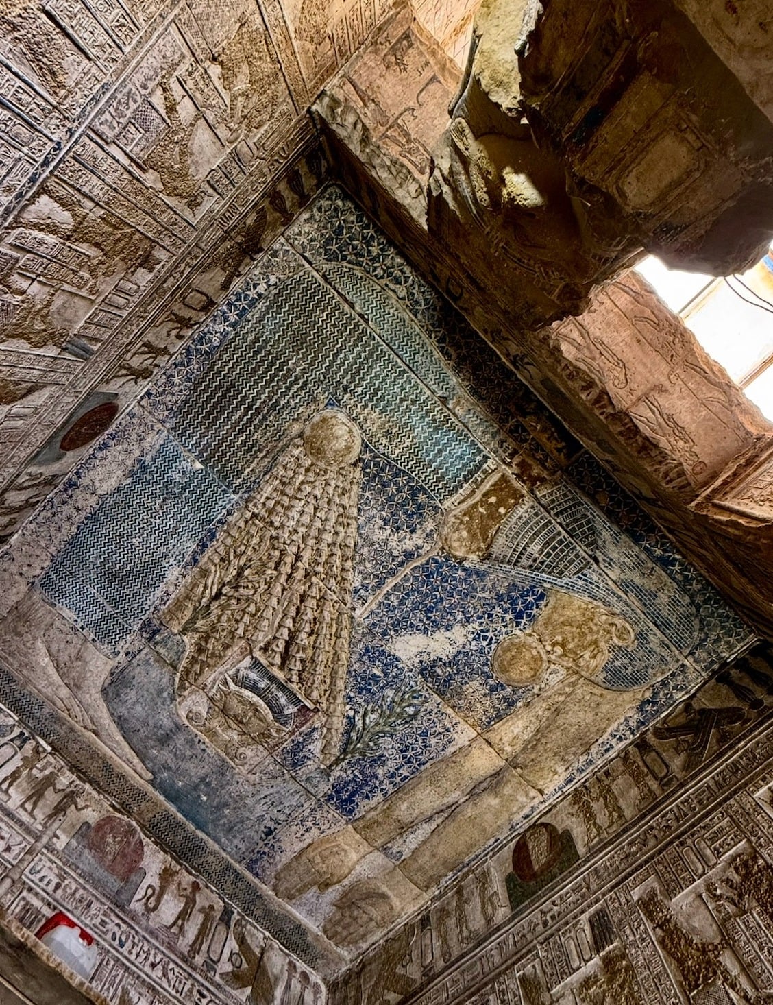 Vibrant painted ceiling at Dendera Temple Egypt showing goddess Nut and astronomical scenes