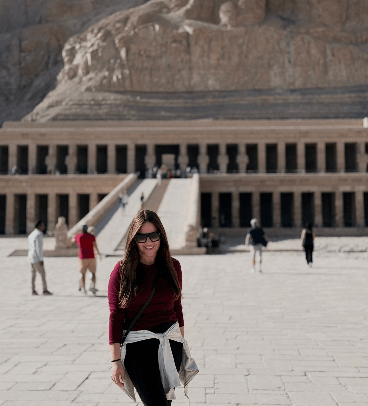 Tourist exploring Hatshepsut Temple in Luxor Egypt with other visitors in a safe tourism environment